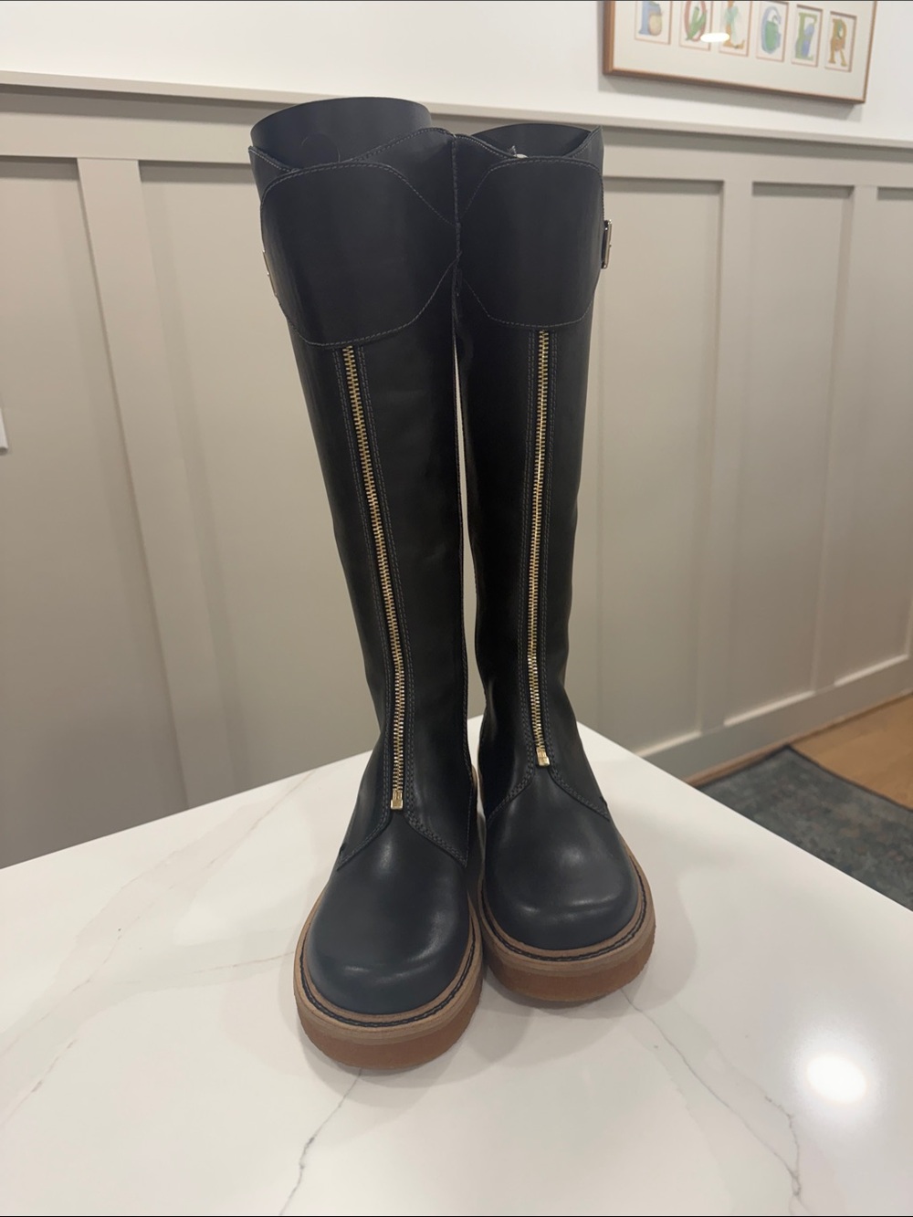 Kelsi Dagger Black Leather Knee-High Boots with Gold Zipper and Tan Sole